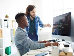 The Cost-Cutting Power Of Crowd Testing: Do More With Less Programmers coding at desk